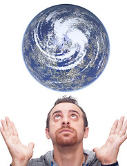 Image showing Man looks at the planet earth 