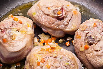 Image showing veal shank cooking in pan