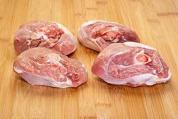 Image showing raw ossobuco on wooden board