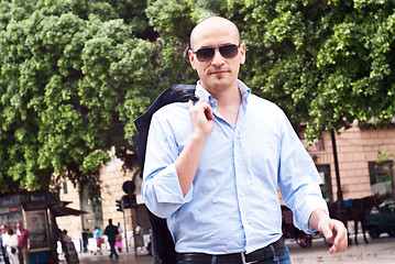 Image showing portrait of a attractive gorgeous guy wearing sunglasses