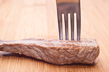 Image showing beef with fork