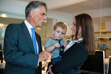 Image showing Businesswoman with small child in the office