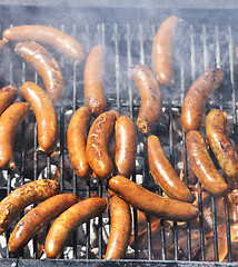 Image showing Fresh Sausages  Grilling Outdoors