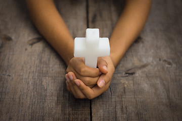 Image showing Holding a Religious Cross