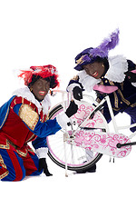 Image showing Zwarte Piet finds a gingernut in his tire