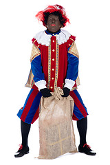 Image showing Zwarte Piet with a bag full of presents