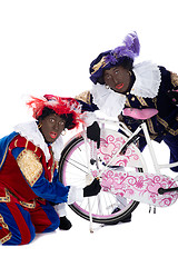 Image showing Zwarte Piet finds a gingernut in his tire