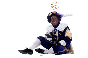 Image showing Zwarte Piet is throwing ginger nuts