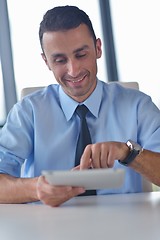 Image showing business man using tablet compuer at office