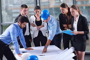 Image showing business people and engineers on meeting