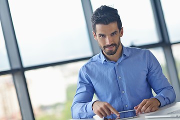 Image showing business man using tablet compuer at office