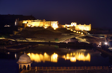 Image showing fort and lake in Jaipur India at night