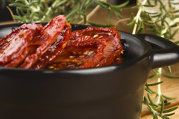 Image showing Sun dried tomatoes with olive oil