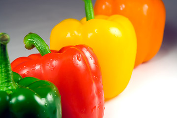 Image showing Four wet peppers