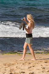 Image showing Woman Trying to Photograph Sea Turtles, North Shore, Oahu, Hawai