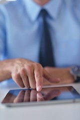 Image showing business man using tablet compuer at office