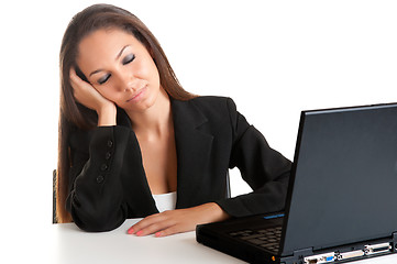 Image showing Businesswoman Sitting at Her Desk Sleeping