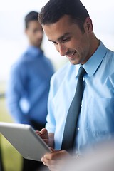 Image showing business man using tablet compuer at office