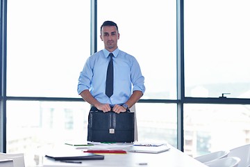 Image showing business man waiting for meeting to begin in Board room