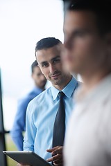 Image showing business man using tablet compuer at office