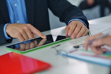 Image showing business man using tablet compuer at office