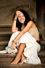 Image showing woman sitting on wooden stairs