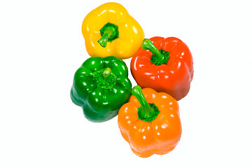 Image showing Four wet peppers top view