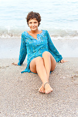 Image showing woman in blue dress on the beach