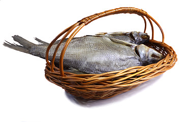 Image showing Salted and dried fish river in a basket on a white background.