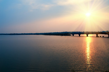 Image showing sunset over river with bridge
