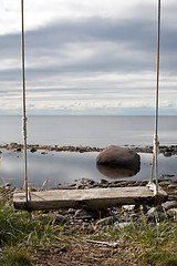 Image showing wooden swing with ropes