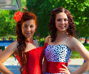 Image showing Two young girls in beautiful dresses