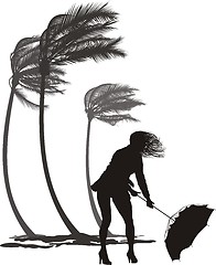 Image showing Female in the wind and trees palms 