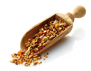 Image showing wooden scoop with dried spices