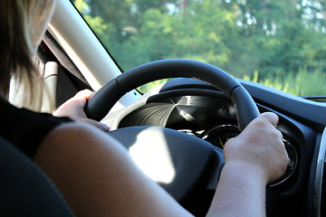 Image showing Young woman driving the car