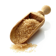 Image showing wooden scoop with brown sugar