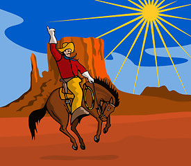 Image showing Rodeo Cowboy Riding Horse