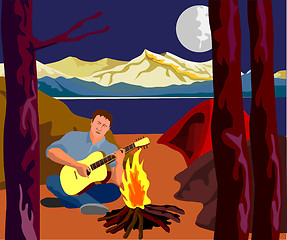 Image showing Man Camping Playing Guitar