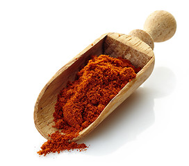 Image showing wooden scoop with paprika powder