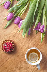Image showing Violet tulips on the wood