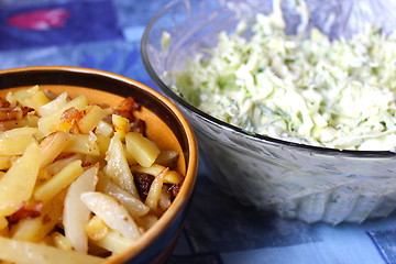 Image showing plate full of tasty chips and salad from cabbage