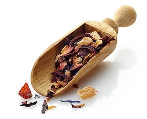 Image showing wooden scoop with fruit tea