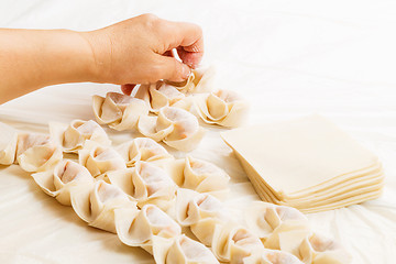 Image showing Homemade dumpling with human hand