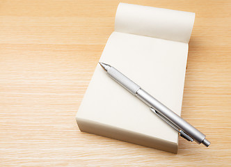 Image showing Memo pad and pen on the table