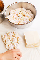 Image showing Homemade dumpling with human hand