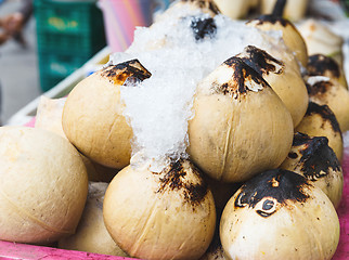 Image showing Young coconut drinks on street