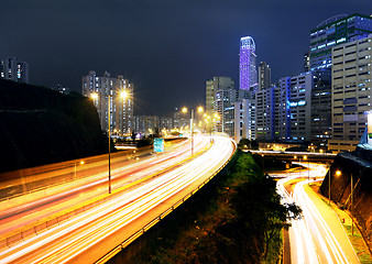 Image showing moving car with blur light through city at night