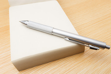 Image showing Memo pad and pen on the table