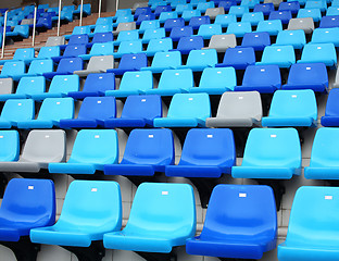 Image showing blue plastic old stadium seats on concrete steps