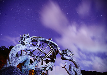 Image showing Armillary sphere with galaxy sky